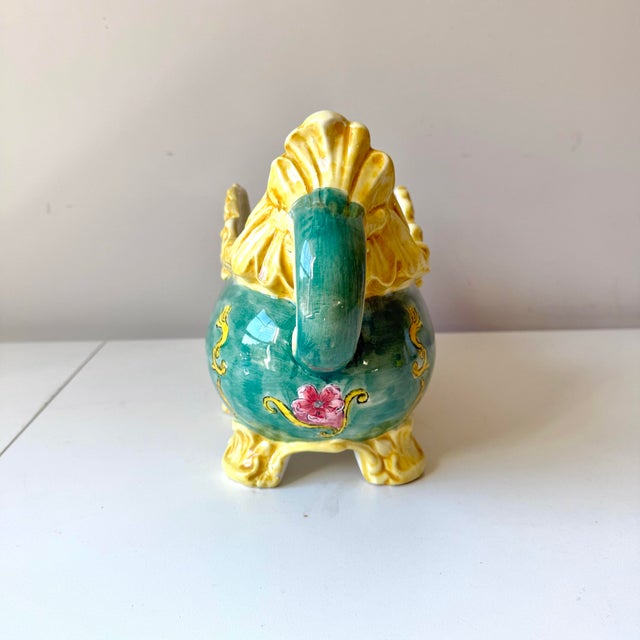 Vintage and vibrant hand painted floral majolica jardiniere. THe piece is in a lovely yellow, green, and pink.