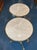This product is a pair of vintage French Empire style gueridon tables, featuring a tabletop made of marble with a bronze...