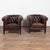 Pair of vintage brown leather club or tub chairs from Denmark. Upholstered in dark vintage brown leather, the chairs...
