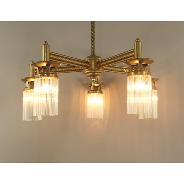 Chandelier with 5 light sources. The lamp is in its original condition, but has been rewired according to today's safety...