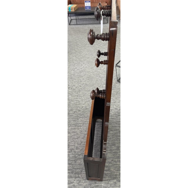 Add timeless charm and practical function to your entryway or mudroom with this beautiful antique wooden hall tree....