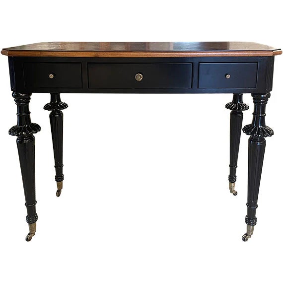 This classic writing desk features a rich wood top with a warm finish and a single center drawer for simple storage....