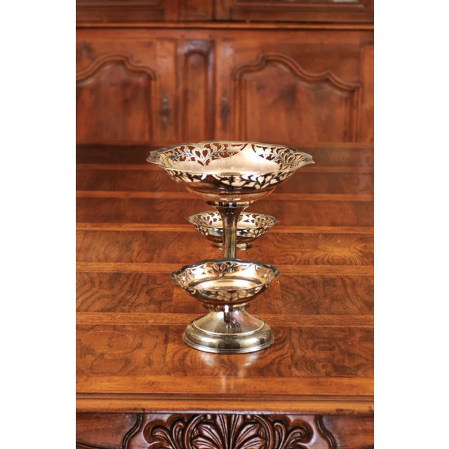 A French silver epergne from the 19th century, with pierced silver bowls and foliage motifs. Created in France during the...