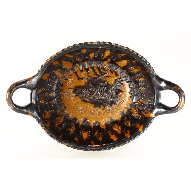 A charming earthenware pottery dish A stunning example of the Mexican Folk Art pottery produced in the renown ceramics...