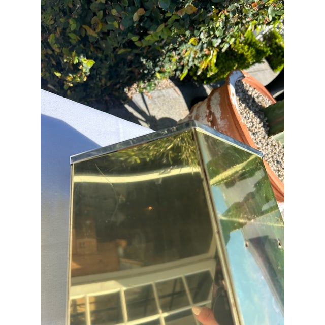 Vintage geometric riser featuring faceted brass sides with chrome trim detailing. The sculptural hexagonal form offers...