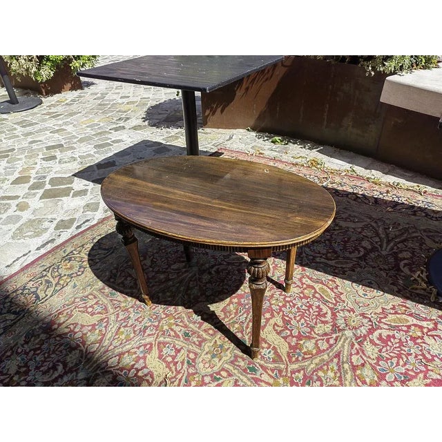 Low Oval Table in Finely Carved Walnut, 1950s, in Very Good conditions. Designed 1950 to 1959