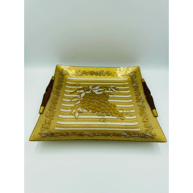 This rare Marcel Guval glass platter/tray has beautiful dark wood handles and features a grape motif with grapevine trim...