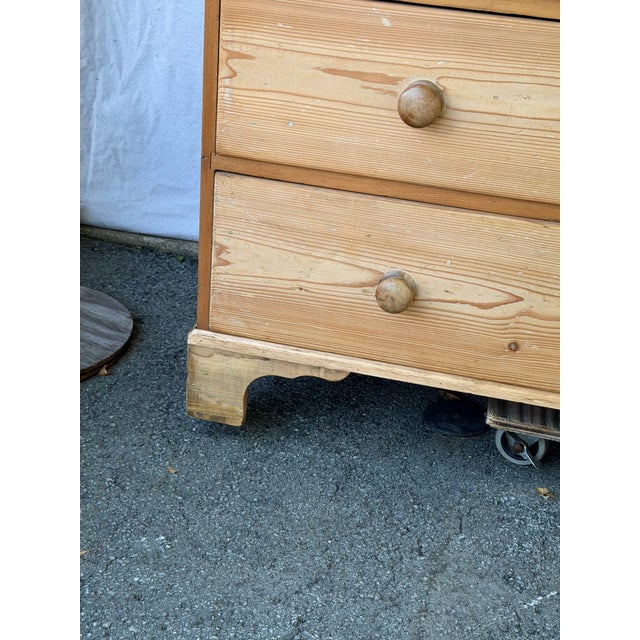 This is a beautiful English Regency pine chest featuring two small drawers over three larger ones. It has a very unique...