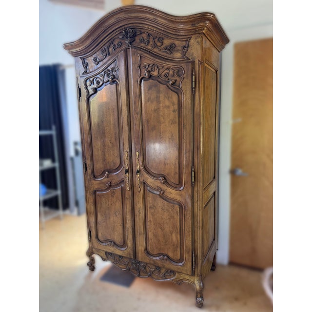 Henredon French Media Armoire from the Channel Crossings collection circa 1992. Beautiful antiqued wood with carved...