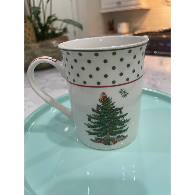 This Spode Christmas Tree Porcelain Mug features the iconic evergreen, decorated with colorful ornaments and surrounded by...