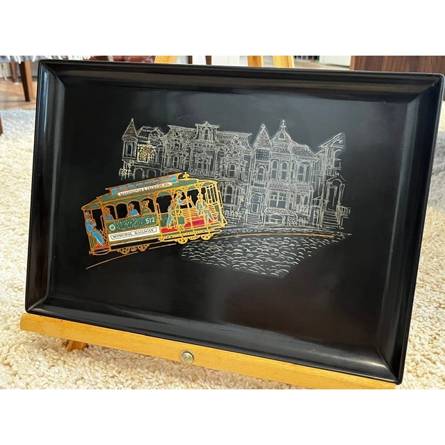 vintage mid-century modern black phenolic resin serving tray featuring an inlaid design of a San Francisco cable car...