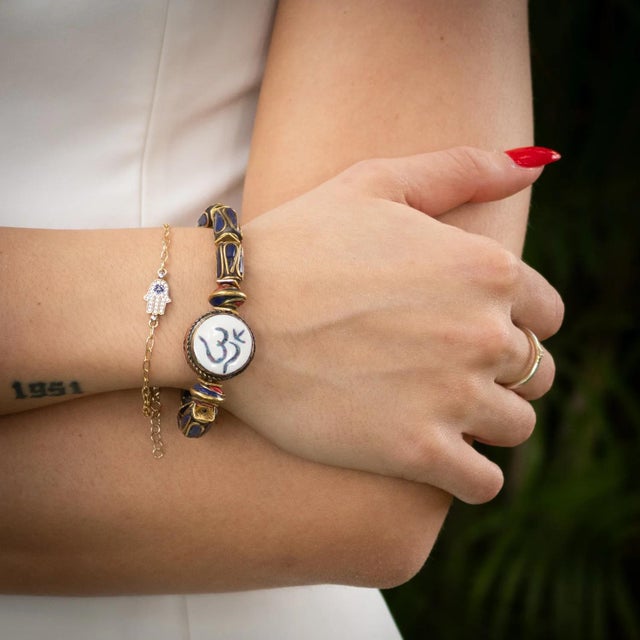 Find your inner calm and express your unique spirit with the Soul Balance OM Charm Bohemian Spiritual Beaded Bracelet — a...