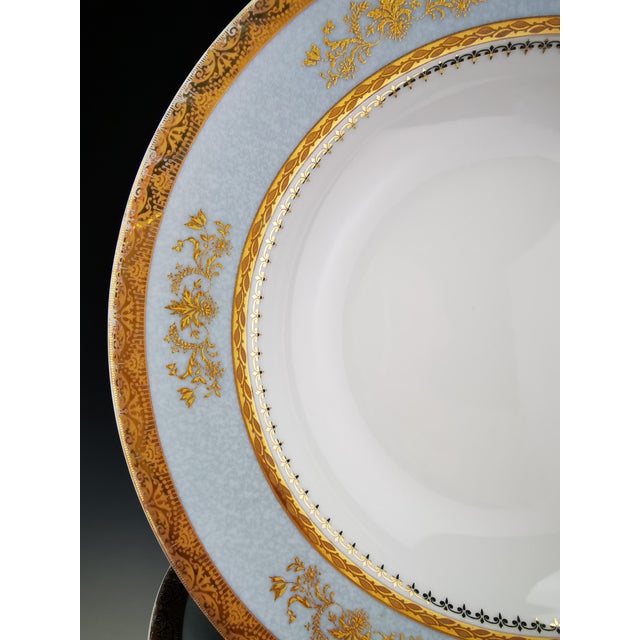 A rare and superb set of six Limoges porcelain soup plates with rims, by Philippe Deshoulières, in the "Orsay" pattern...
