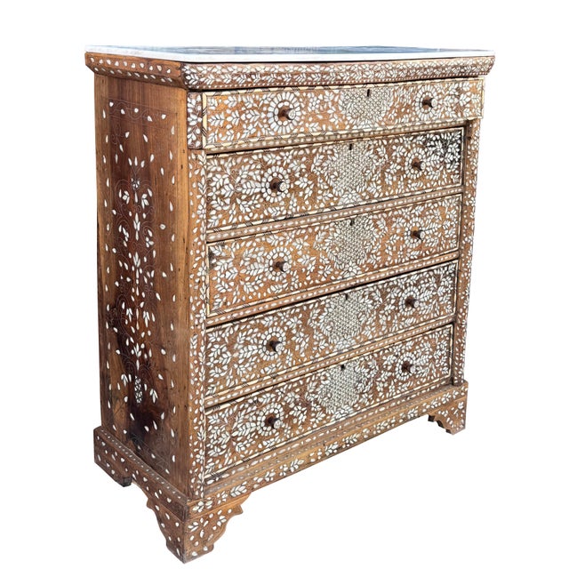 Exotic Handcrafted Mother-of-Pearl Inlaid Chest of Drawers with Marble Top An exceptional mid-19th century chest of...