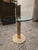 ▪️Leon Rosen for Pace Round Glass, Brass and Travertine Side Table Attributed ▪️Brass cylinder rising appearing to...
