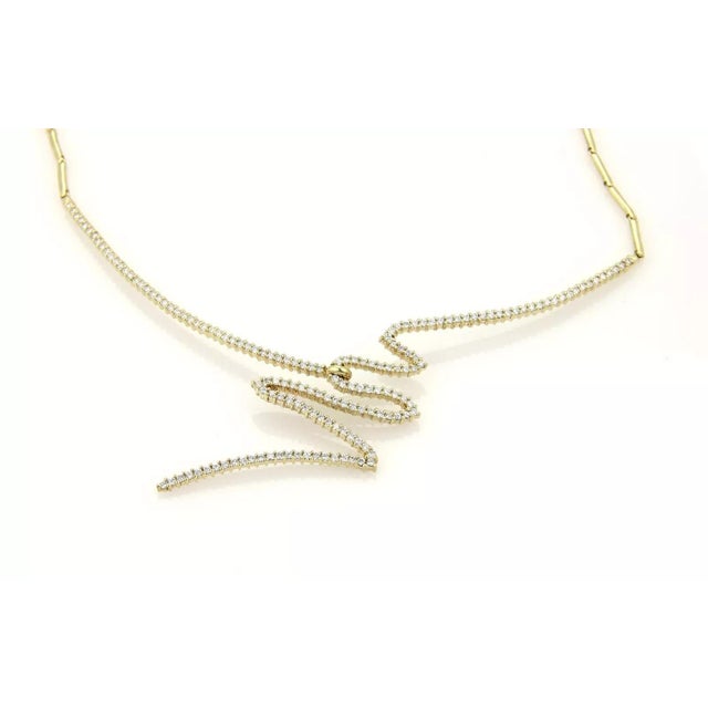 This is a gorgeous diamond necklace by designer Jose Hess, it is crafted from solid 14k yellow gold with long tube like...