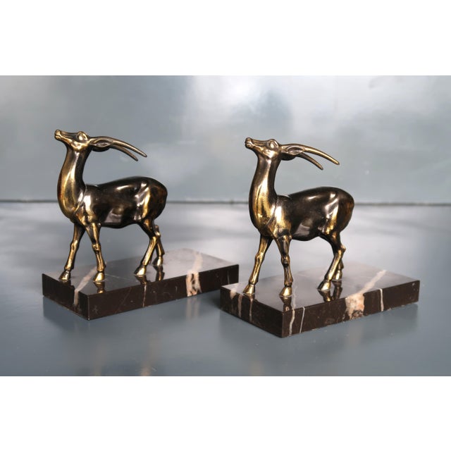 Pair of Art Deco bookends. French work around 1930. Metal sculptures on marble base. Very good vintage condition. Height...