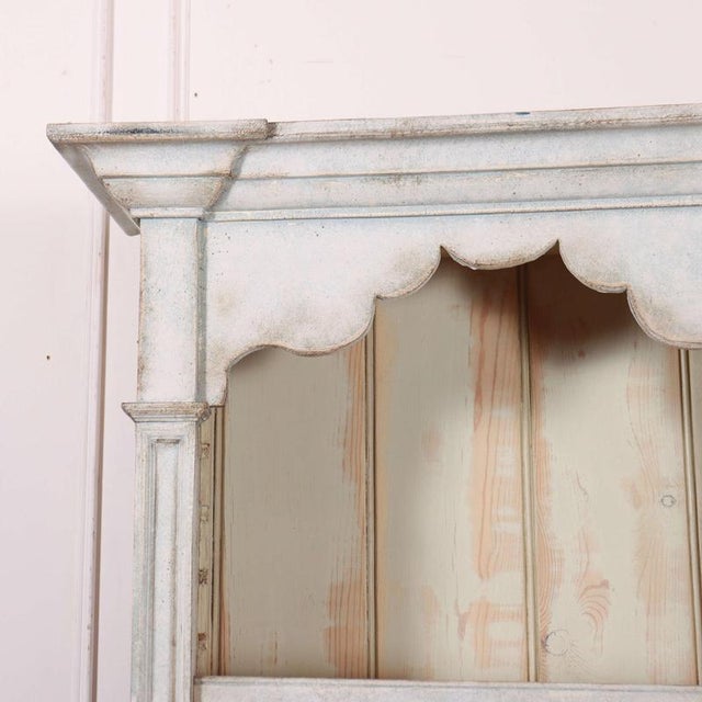 Interesting late 19th C French painted narrow bookcase, lovely worn paint. 1880 Shelf depth 27.5cm This piece is designed...