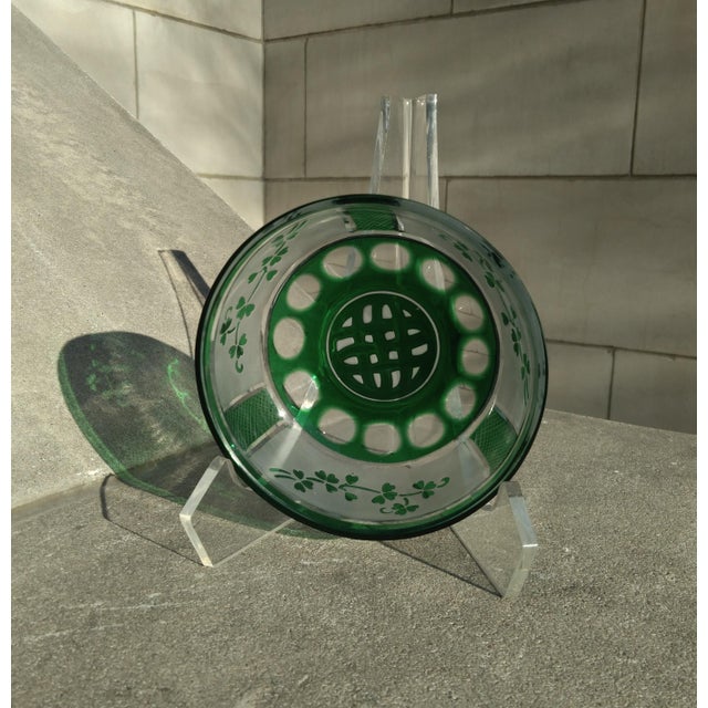 This small bowl, packs a bundle of cultural and creative power. It is, at base, a green cut to clear bowl weighing over...