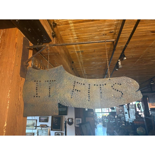 One of a kind boutique shoe cobbler/store sign with a fantastic, hammered texture that shows its history as an attention-...