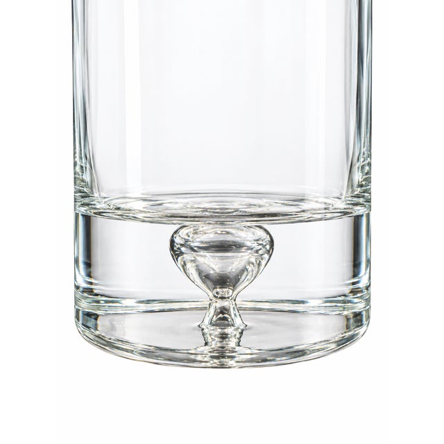 Elegant vintage clear glass decanter featuring a controlled bubble detail within the glass and a fitted frosted glass...