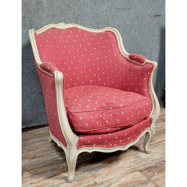 A very large, curved louis xv style bergère chair in lacquered wood, circa 1900. Attractive patterned upholstery in very...