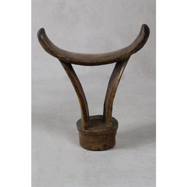 These solid wood Headrests are from groups in southern Ethiopia used to enable people to sleep without interfering with...