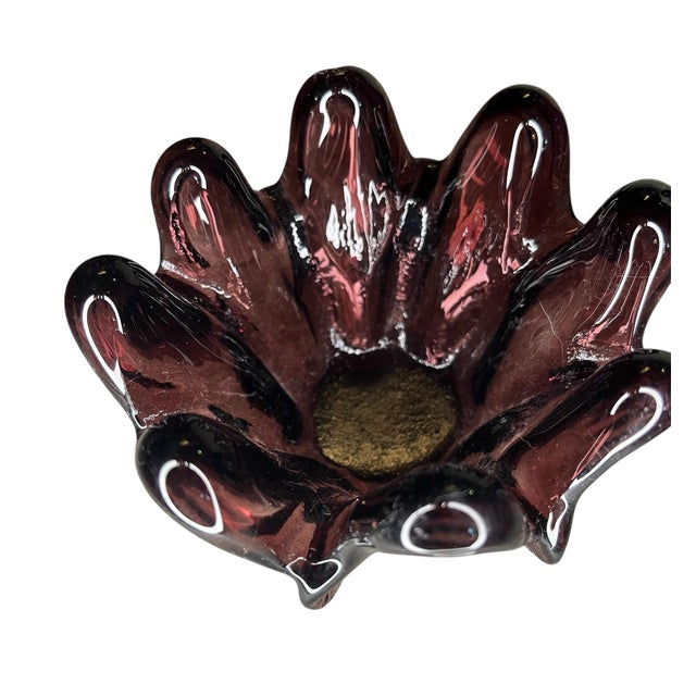 Elegant deep purple glass tabletop decoration. Holds a tea light candle which will nestle safely right in the center....