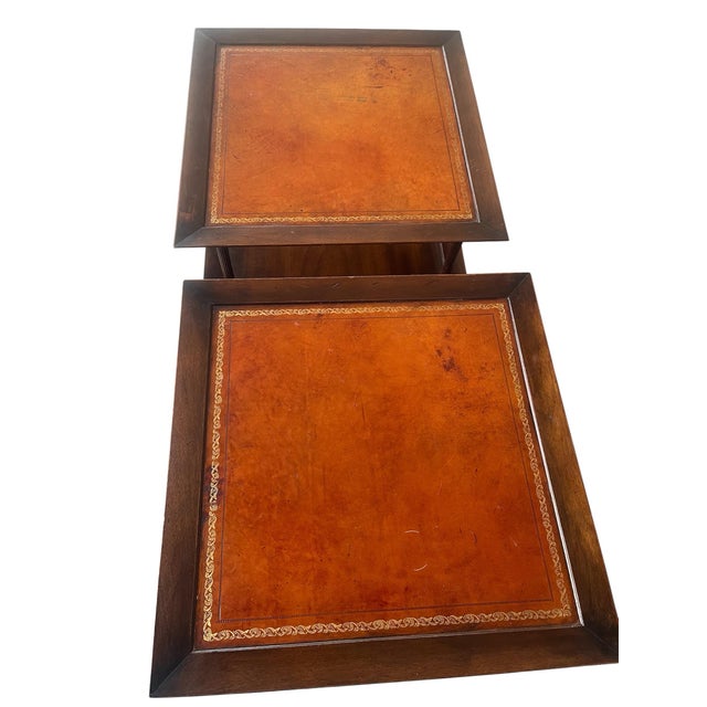 Regency-style mahogany three-tier side tables, often referred to as whatnots or etageres. Leather tops in good condition...