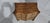 A super deep serpentine mahogany chest of four drawers of small proportions, blind fretwork to the chanfered sides,...
