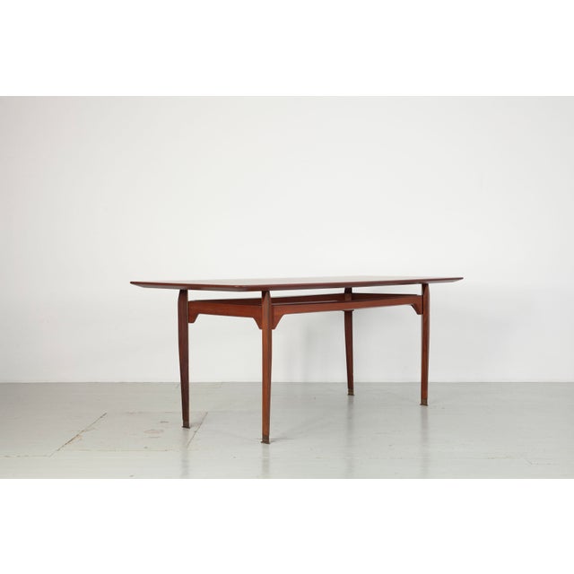 Restored teak dining table, 1960s – La Permanente Mobili Cantù An elegant 1960s table from the renowned brand La...