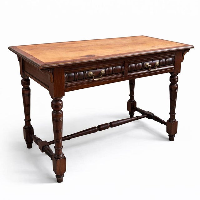 A handsome antique console table crafted from a mix of mahogany, pine, and oak, showcasing traditional craftsmanship and...