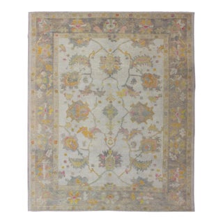 Turkish Oushak Rug With Muted Color Palette and All-Over Flower Design For Sale