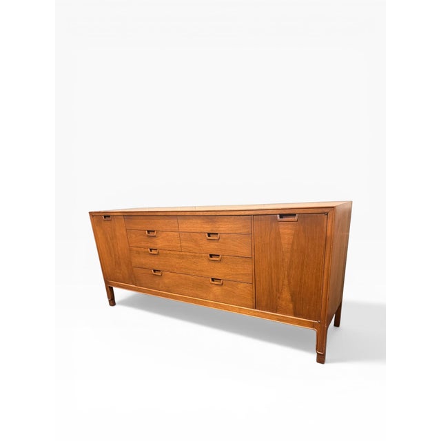 Refined mid-century modern credenza from the Janus Collection by John Stuart, showcasing exceptional craftsmanship and a...