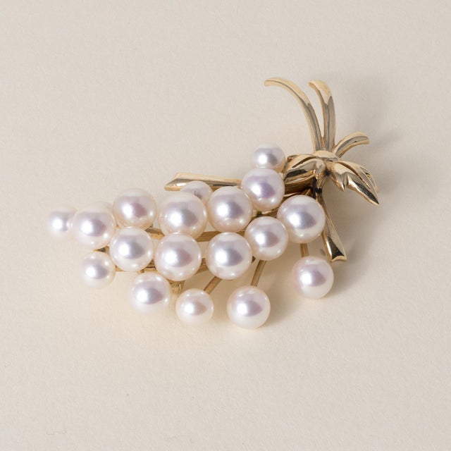 Vintage Mikimoto Cultured Pearl Bouquet Brooch This elegant vintage bouquet brooch from the Mikimoto collection showcases...