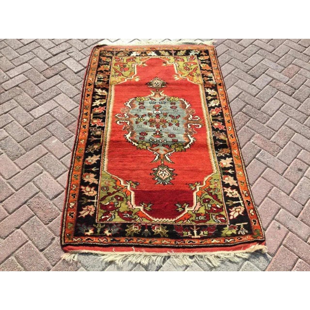 This gorgeous hand knotted vintage Anatolian rug is approximately 60 years old in excellent vintage condition. The rug is...