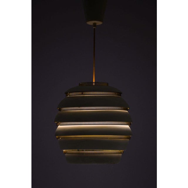 Beehive lamp in brass, white lacquered metal by alvar aalto, 1953 additional information: material: brass, white lacquered...
