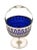 A beautiful sterling silver basket with a cobalt blue liner by Graff, Washbourne & Dunn. Standing proudly on a pedestal —...