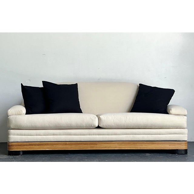 This elegant vintage stacked reed sofa is a refined example of timeless rattan craftsmanship, blending natural texture...