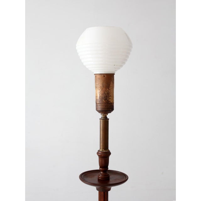 This antique Arts & Crafts floor lamp, circa 1910–1925, features a distinctive rack-and-slide mechanism that allows the...