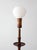 This antique Arts & Crafts floor lamp, circa 1910–1925, features a distinctive rack-and-slide mechanism that allows the...