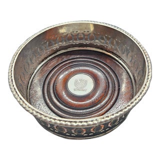 Antique Silver Plate and Wood Wine Bottle Coaster With Silver Phoenix Embossed on Pendant For Sale