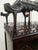 An exceptional 19th-century style mahogany display cabinet features a tripartite architectural façade. The central section...