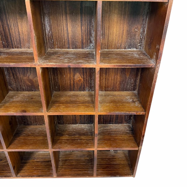 Offering this wooden cubby shadow box display shelf. Finished in dark brown weathered stain. Light weight for easy...