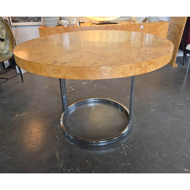 Gorgeous 70s era burl wood 45" dining table with beautiful grain pattern sitting on a Chrome base. Included is an 18" leaf...