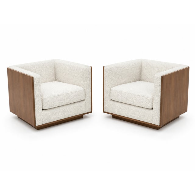 Mid century moder lounge chairs. Crafted with solid walnut panels and upholstered in luxurious white Boucle fabric, The...