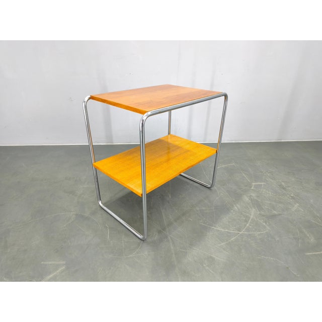 Bauhaus side table from 1930s Czechoslovakia, attributed to the design principles of Marcel Breuer. This piece features a...