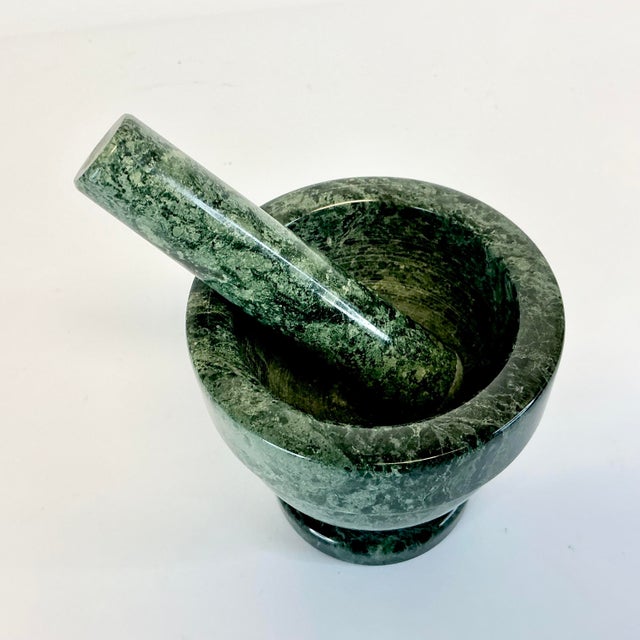 This Mortar and Pestle from the 1970s is crafted from a gorgeous piece of green marble. It’s has a gorgeous color graining...