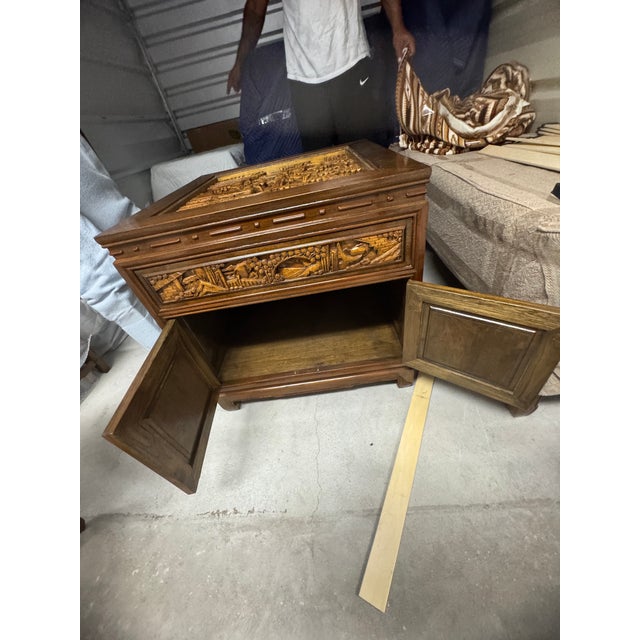 Breathtaking and highly detailed, this vintage South East Asian end table features a masterfully hand-carved top panel...