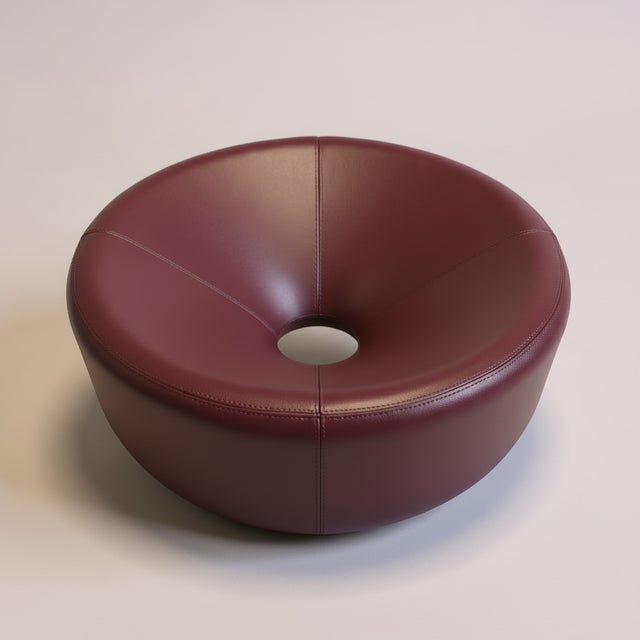 Sink into sculptural comfort with this distinctive concave lounge sofa. The rounded, bowl-like design creates an intimate...